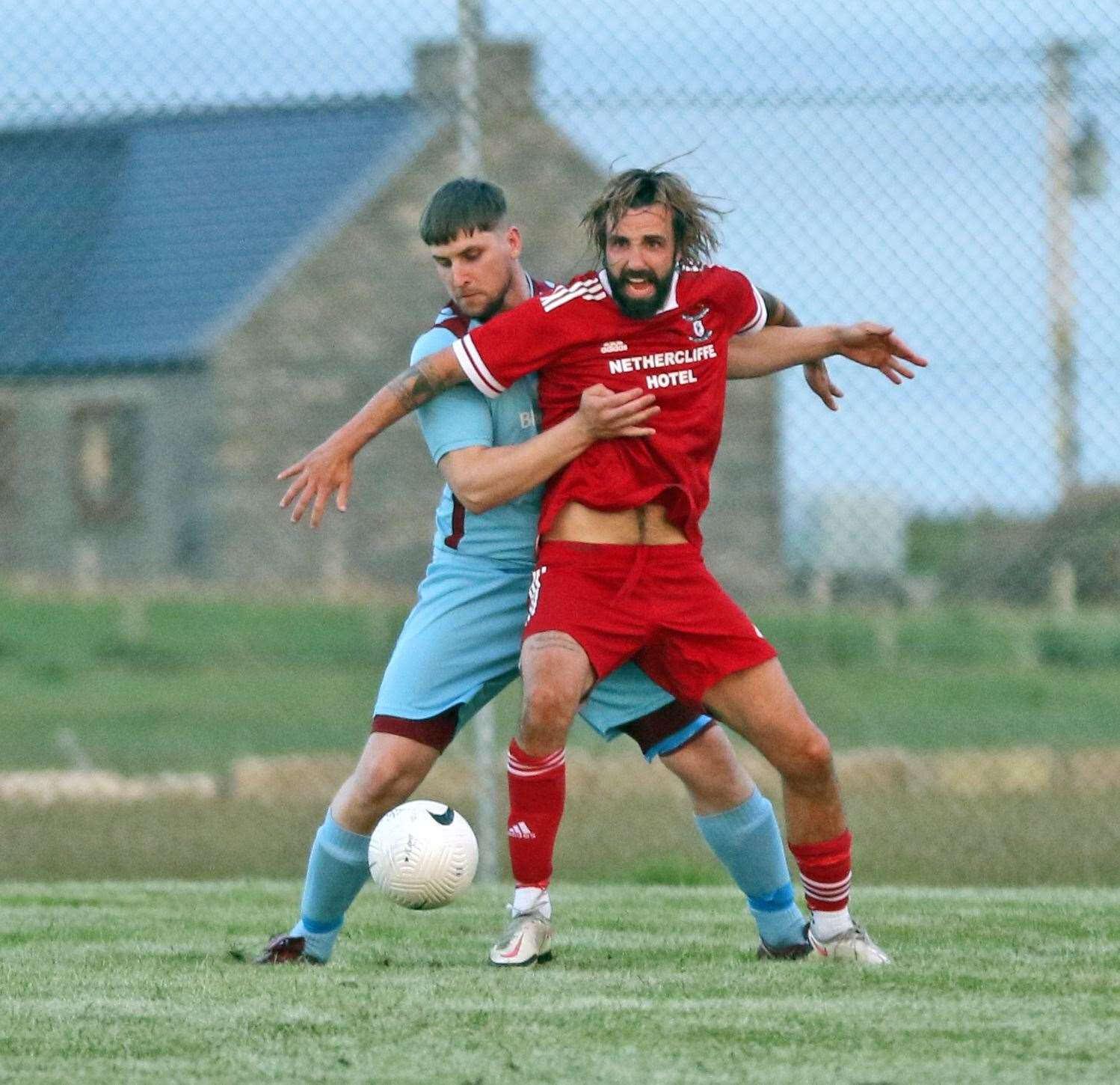 Pentland United's Grant Steven gets to grips with Grant MacNab (Wick Groats) during the goalless draw at Ham Park. Picture: James Gunn