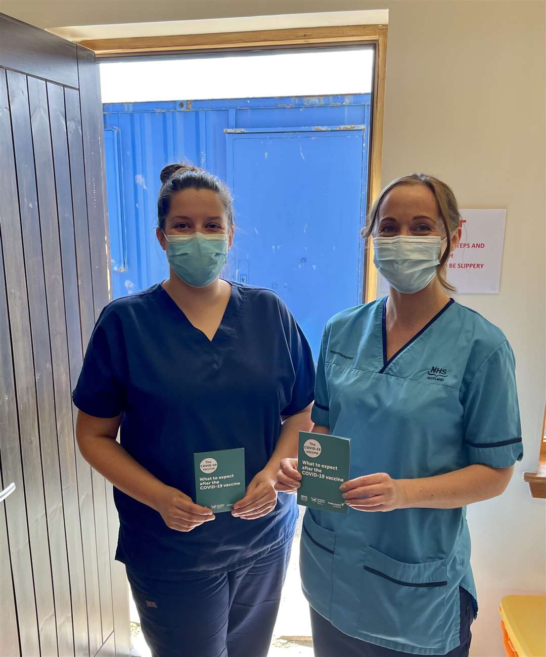 Practice nurse Fiona Sutherland and physio Lynne Tait who are working on Covid vaccines at Wick's Pearson Practice. They are standing at the new door, part-funded through Tannach and District Community Council, which allows for a one-way system and social distancing.