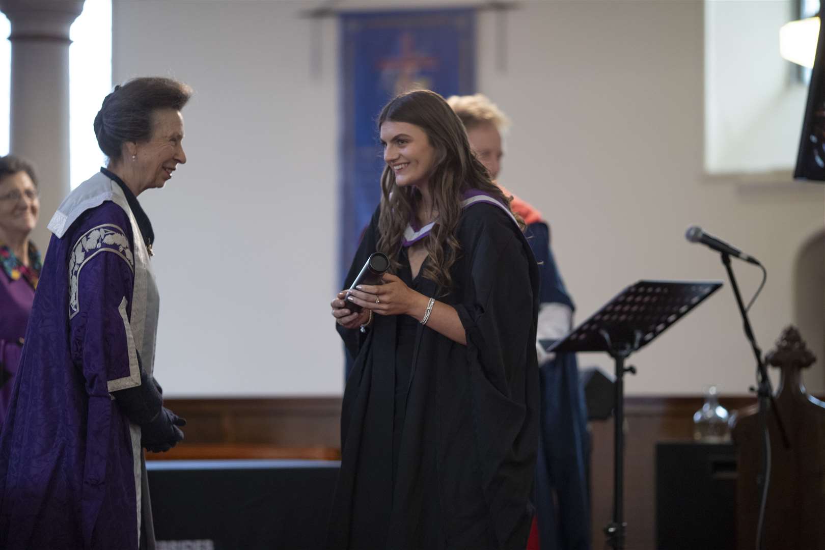 Neave MacLeod receives her certificate from Princess Anne.