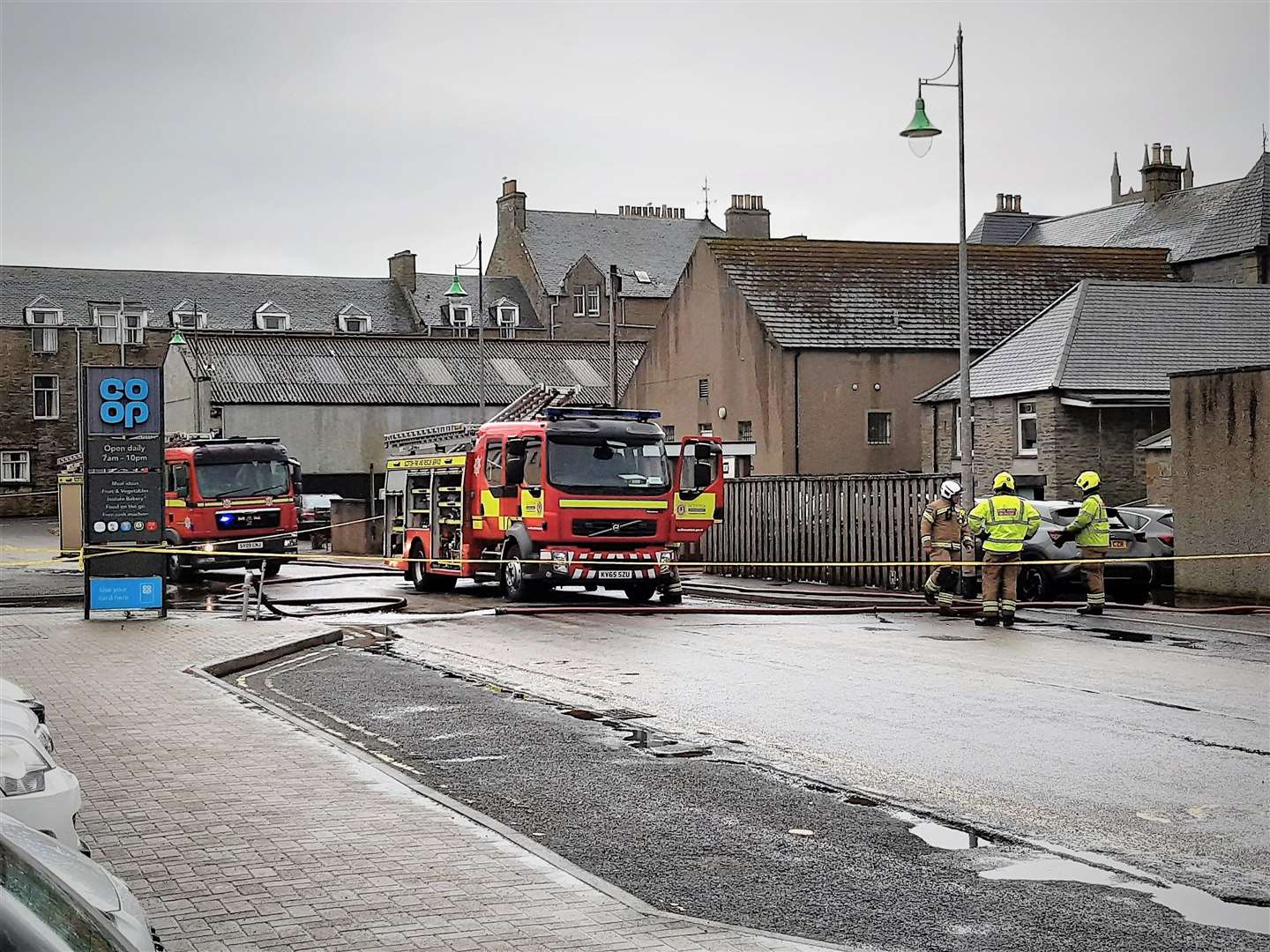 Thurso fire crew members operating in Thurso town centre after the waters receded. Picture: Matthew Reiss