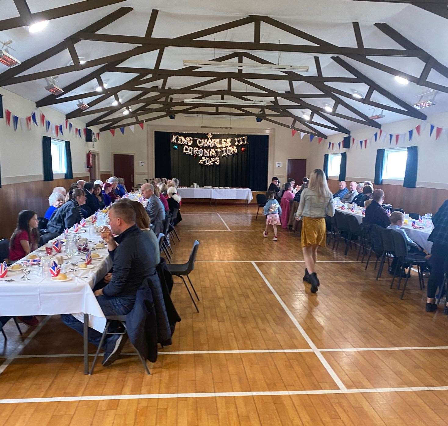 Local people enjoying the King's lunch at Dunbeath Community Centre on Sunday.