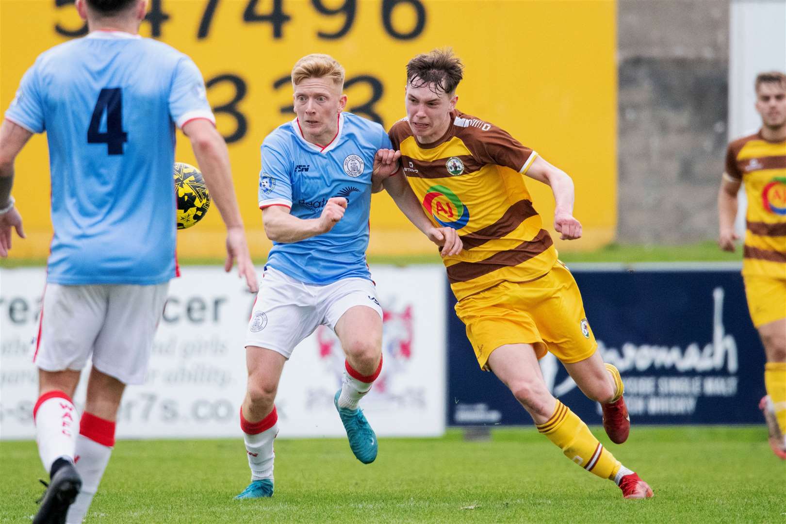 Wick Academy's Ross Gunn and Calum Frame of Forres Mechanics compete for the ball. Picture: Daniel Forsyth