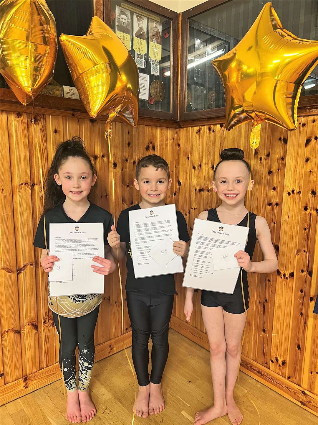 From left, Evie, Thomas and Nola receiving their DIVA Awards nominations.