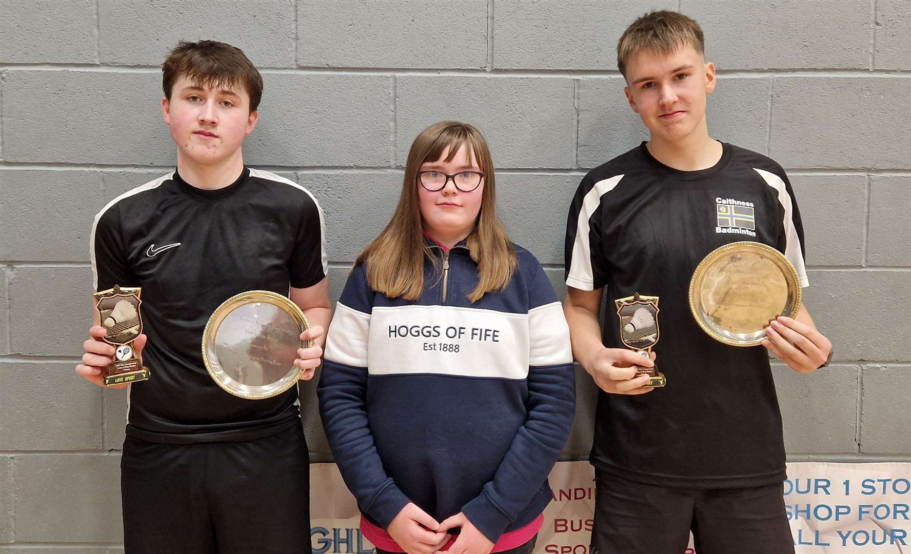 Boys' doubles winners Lewis Malcolm (left) and Alexander Mackay with Lexie Mackenzie.