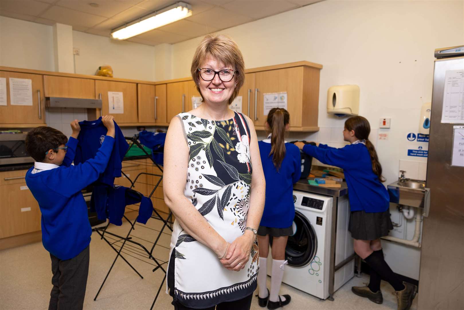 Executive headteacher, Sarah Smith visits the laundry facilities at St Cuthbert’s Catholic Academy in Blackpool, which have been provided by smol in collaboration with The Hygiene Bank (James Speakman/PA)