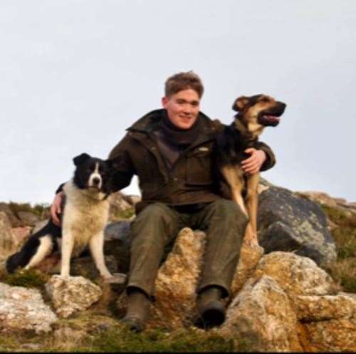 Mure with his collie Fred and Ruby, the NZ Huntaway, at Armadale Farm.