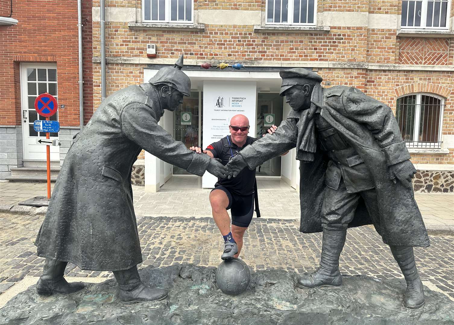 Kev at a statue commemorating the Christmas truce in World War I during the three-day Pedal to Ypres challenge in July.