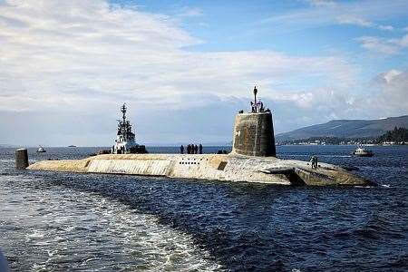 The Vanguard submarine arrives back at the Clyde Naval Base (Bill Spurr/PA)