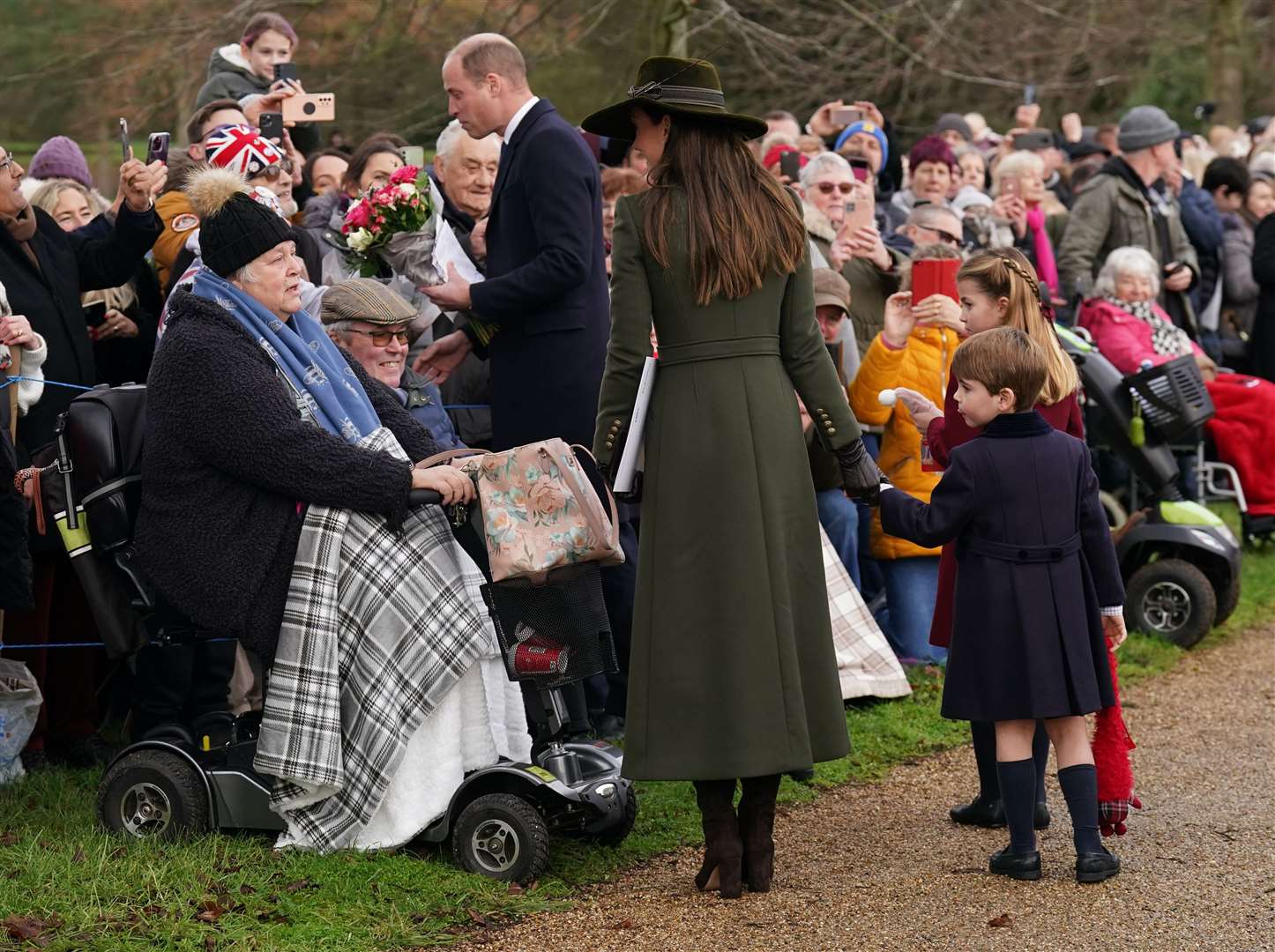 Members of the royal family meet people who travelled to Sandringham to see them (Joe Giddens/PA)