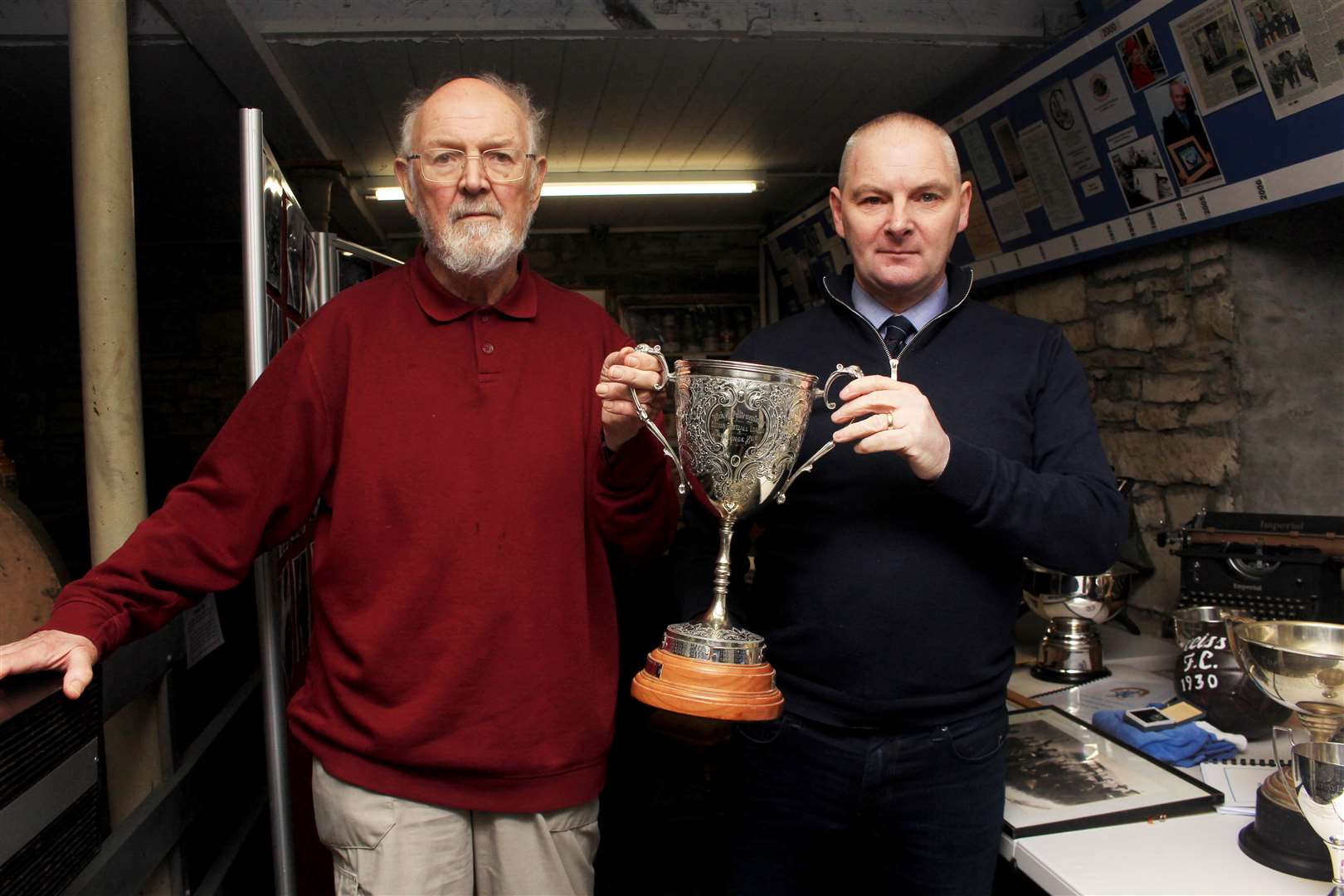 Ken Wood (left) and Angus Mackay holding the Wick and Pulteneytown Senior Football League Challenge Cup – the oldest known Wick football trophy. Picture: Alan Hendry