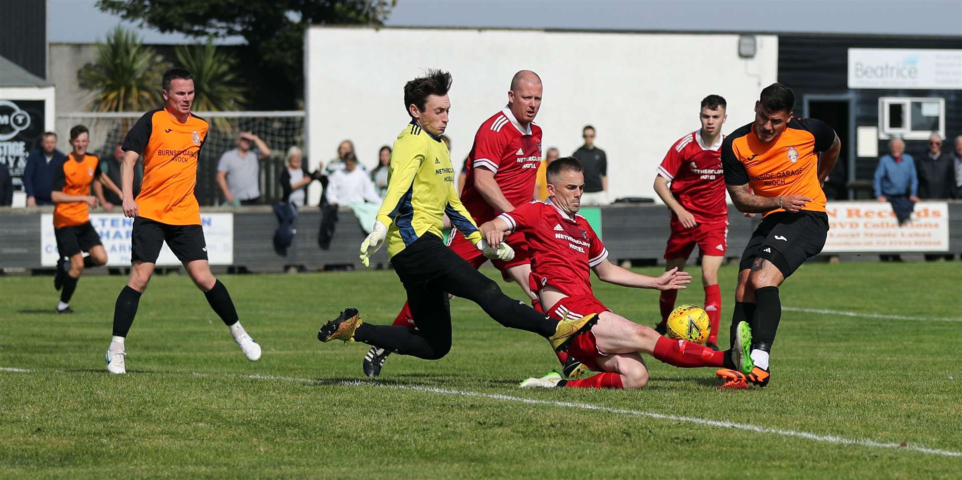 Stuart Leslie's shot is blocked by Wick Groats defender John Budge as goalkeeper Kieran Macleod flies in. Picture: James Gunn