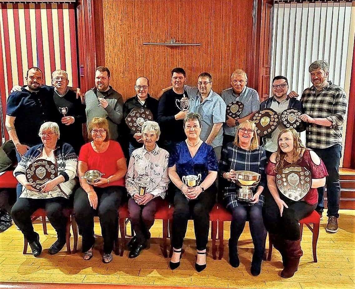 Pulteney Indoor Bowling Club with trophies at their evening event in Wick.