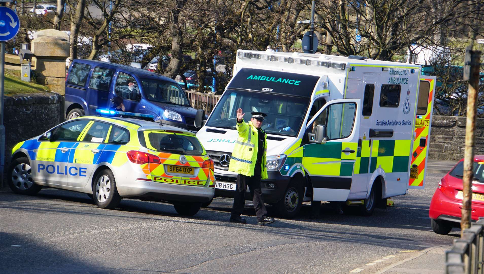 Police and ambulance attend to the injured man near the war memorial in Wick.