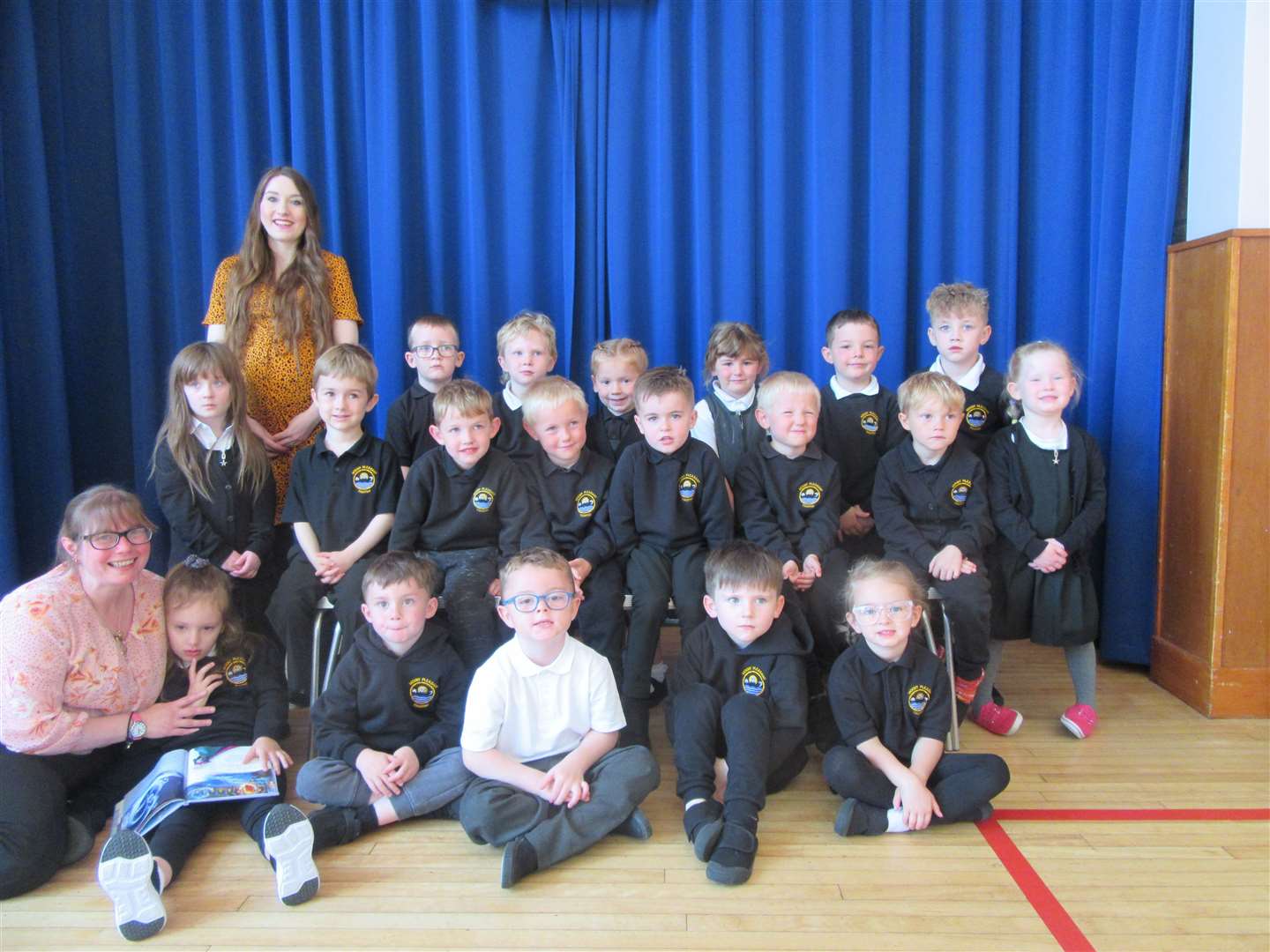 The new primary 1 intake at Mount Pleasant Primary School in Thurso, with class teacher Mrs Laura Tait (back, standing) and volunteer Mrs Sara Taylor (front left).