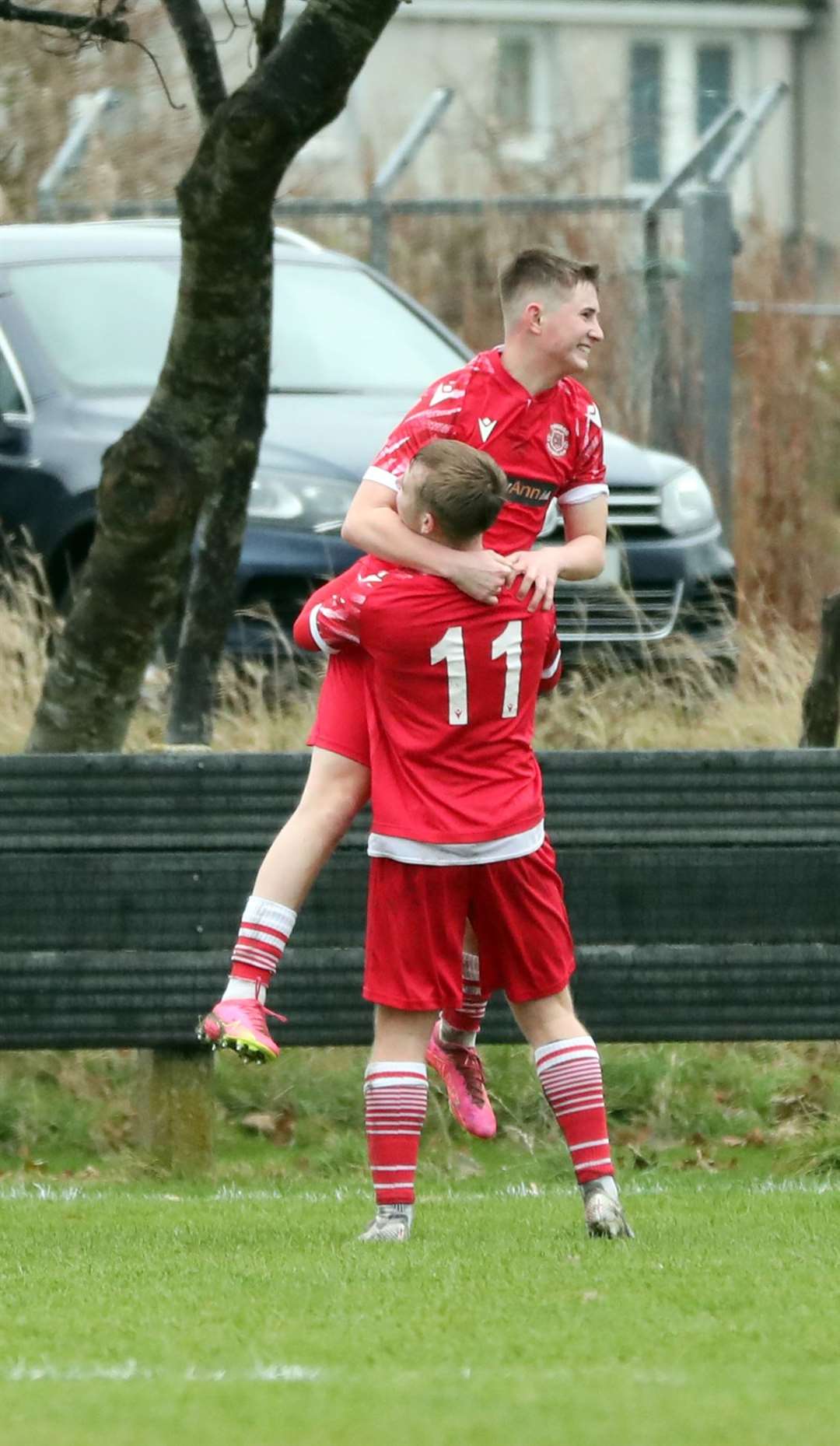 Cameron Montgomery lifts up goalscorer Liam Bain. Picture: James Gunn