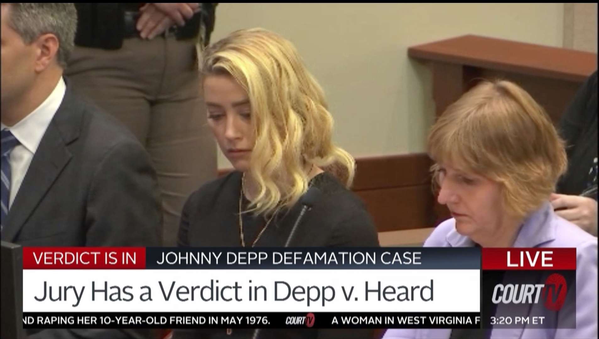 Ms Heard, who was present, was sitting between members of her legal team at the front of the court room, looked downcast as the ruling was read out by the judge (Court TV/AP)
