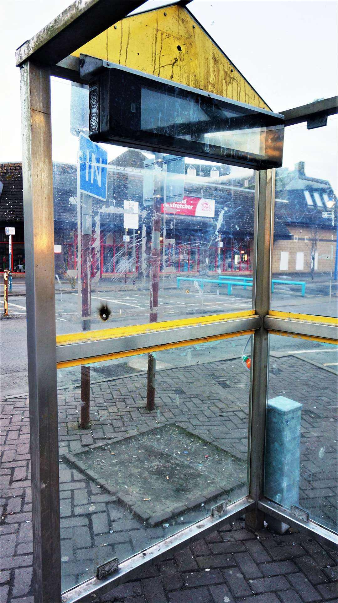 Another view of the busted bus stop.
