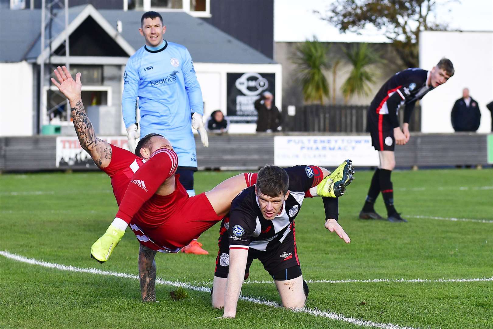 Formartine United's Jonathan Smith tumbles over Wick Academy's Ross Allan during the league match at Harmsworth Park last Saturday. Picture: Mel Roger