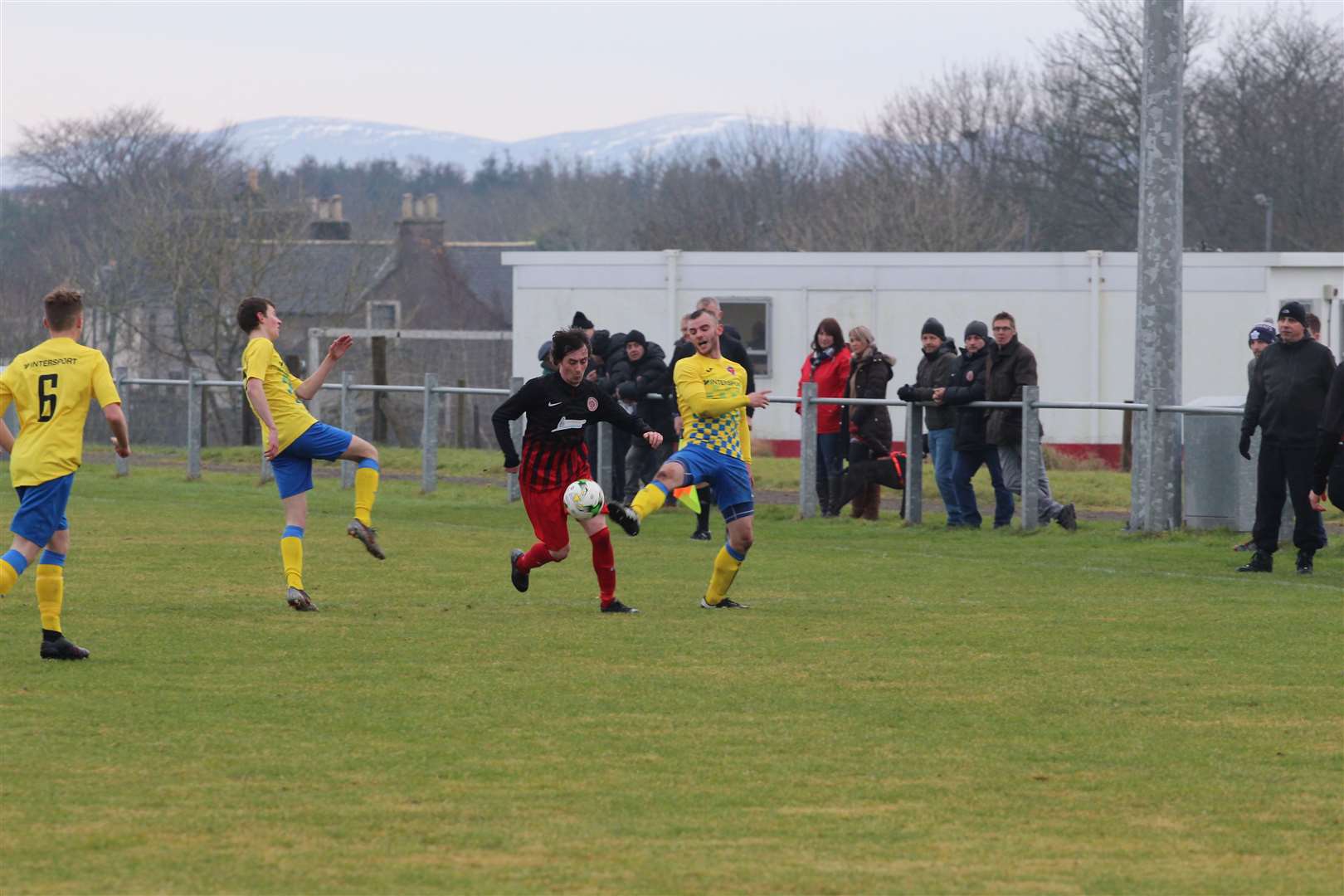 Jordan Howden in the thick of the action for Halkirk United during their defeat to Orkney. Picture: Niall Manson