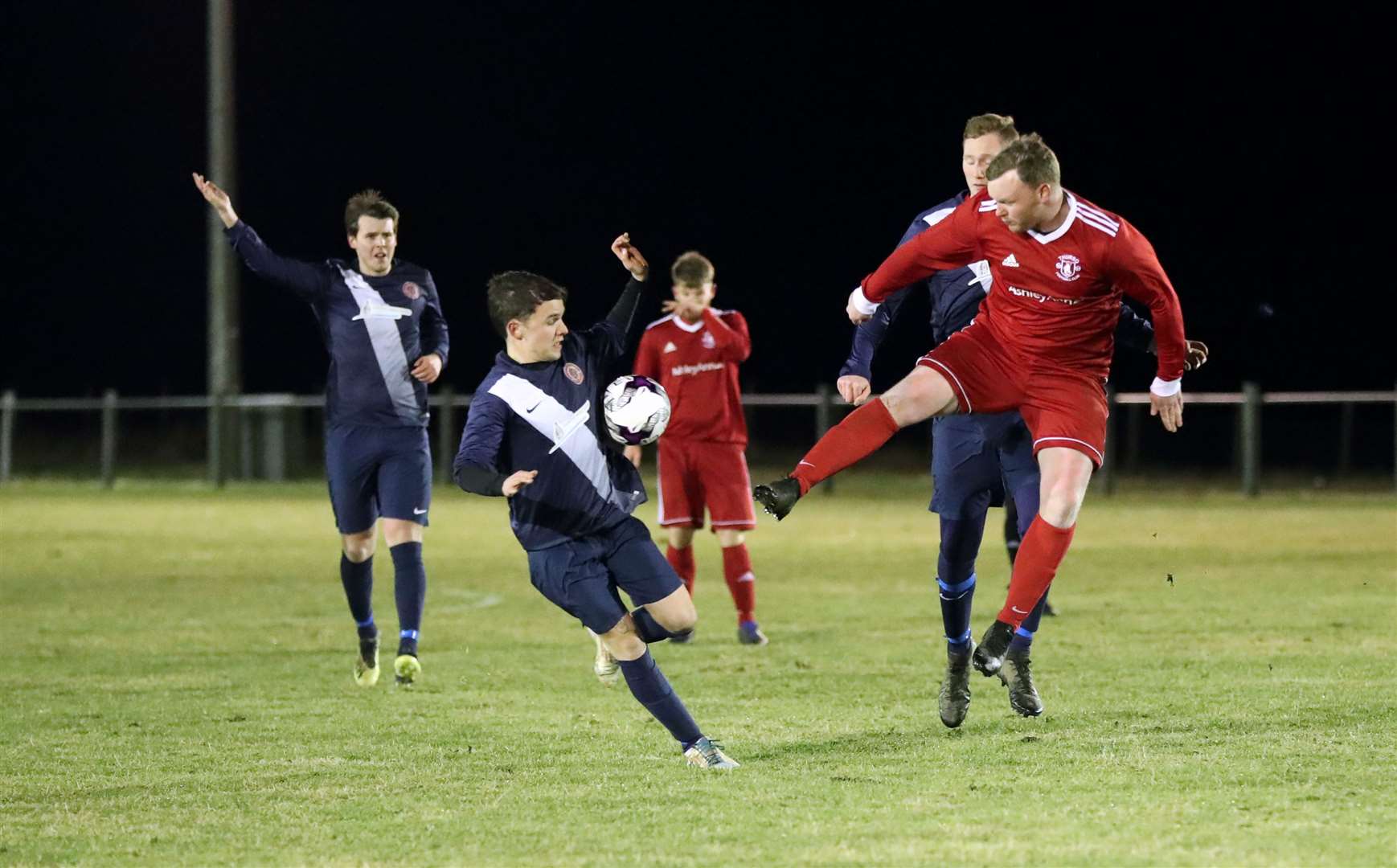 Halkirk United defender Murray Mackay clashes with high-flying James Murray of Thurso during a Caithness derby in February this year. Picture: James Gunn