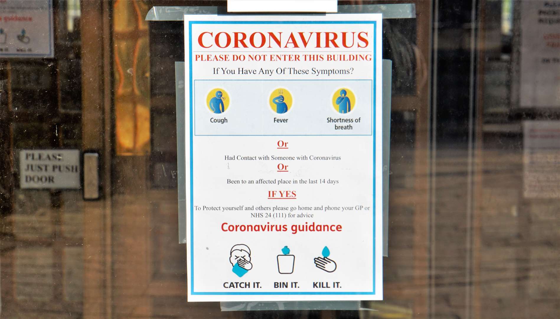Coronavirus warning information on the door of Riverview practice in Wick. Pictures: DGS