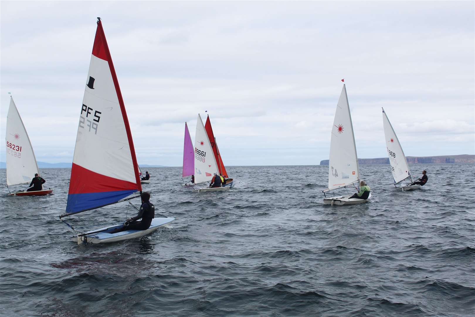 The boats immediately after the start of one of the races, jostling for position.
