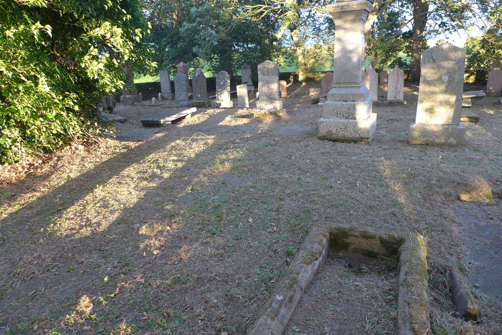 Ancient gravestones now free of overgrown grass and weeds after the voluntary efforts of Willie and Glynis.