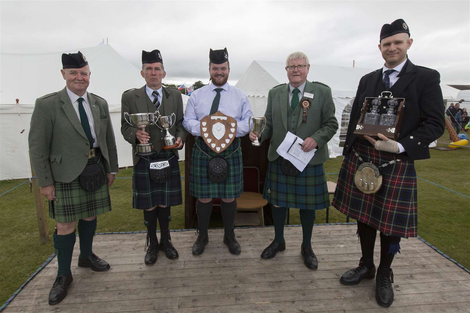 The piping winners were overall champion Brian Lamond (second left), Dunfermline; piobaireachd Angus McPhee (centre), Inverness and Strathspey and Reel Christopher Mcleish (right), Australia. Also in the photograph are judge Archie McLean (left), Inverness, and piping convenor Charlie Swanson. Picture: Robert MacDonald/Northern Studios