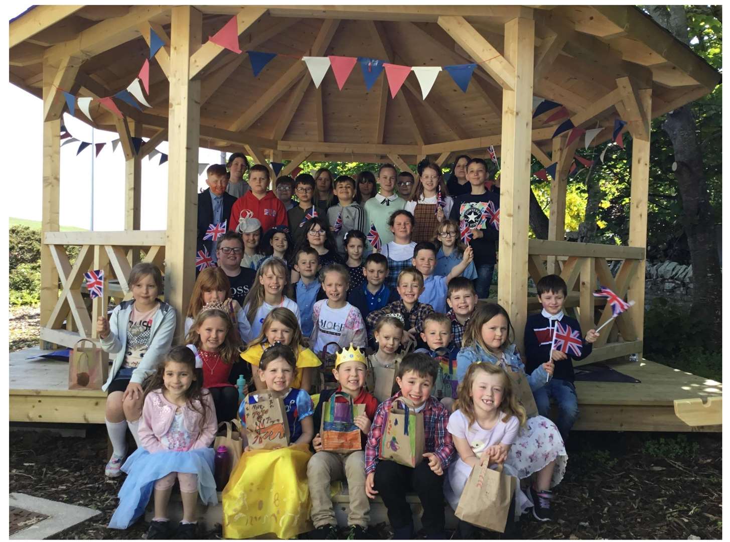 The children dressed up for the special day of celebration for the Queen.