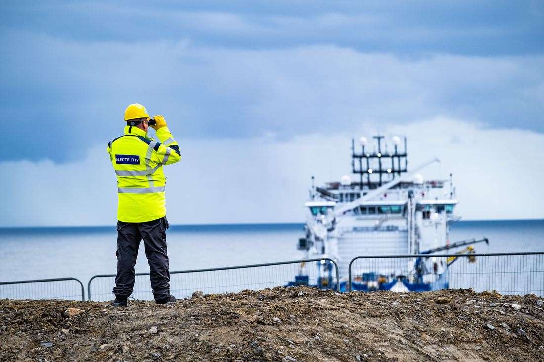 Brian Barnard, SSEN Transmission marine construction manager, observing NKT Victoria from shore.