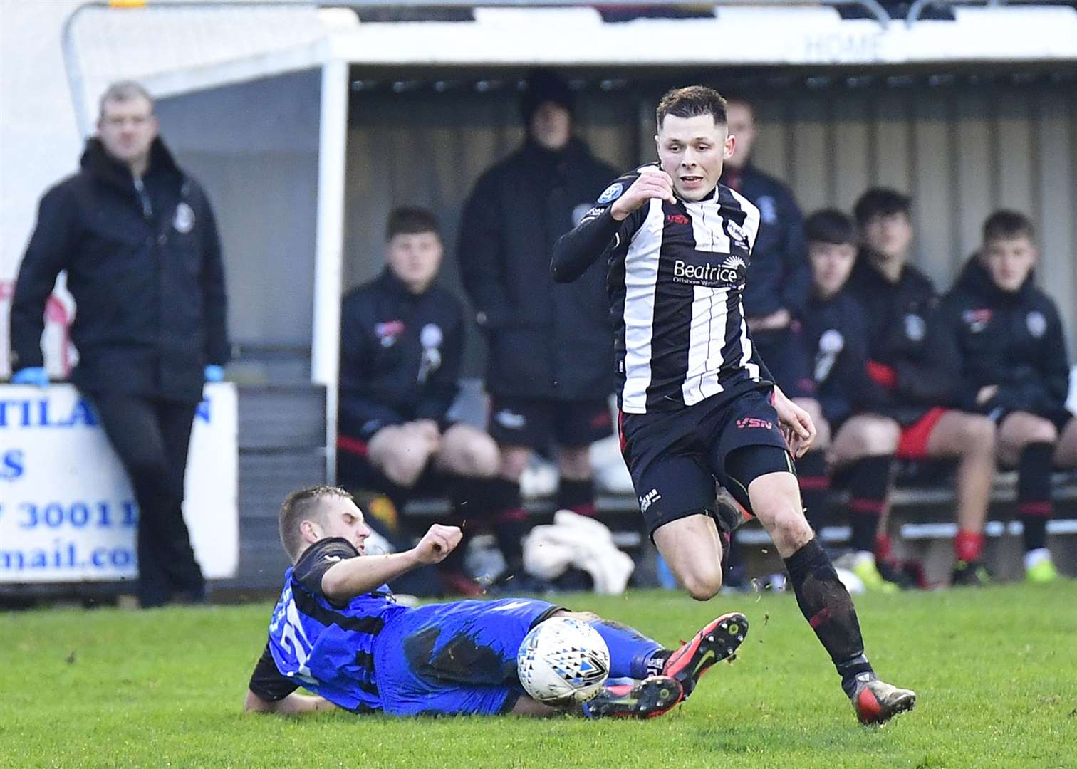 Wick Academy's Jack Henry avoids challenge from Huntly's Chris Hay during the Scorries' 3-0 Highland League Cup defeat. Picture: Mel Roger