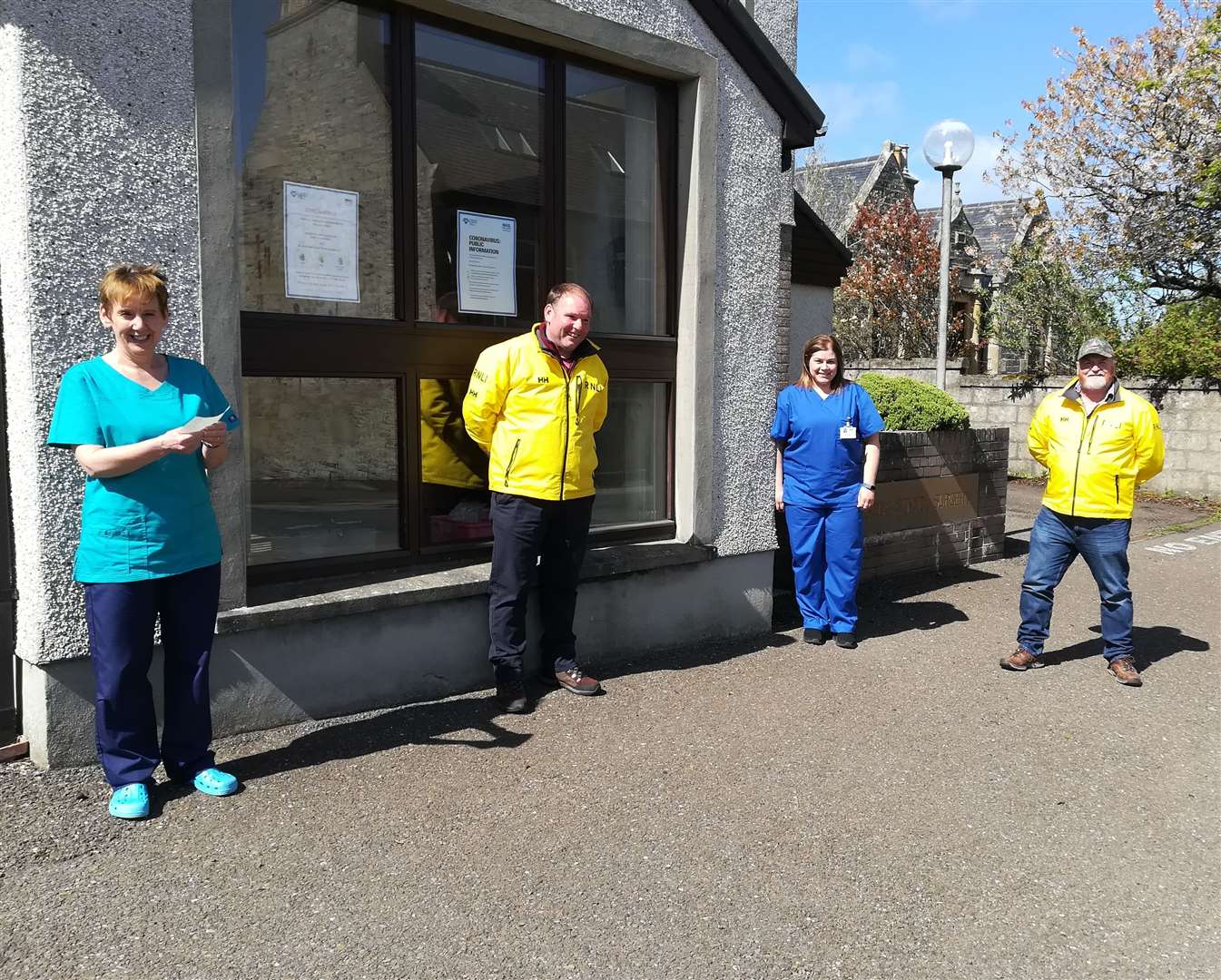 At a socially distancing cheque presentation outside the Princes Street Surgery are (from left) Dr Alison Brooks, Thurso RNLI crew member James Brims, practice nurse Tracy Macleod and crew member Gordon Munro.