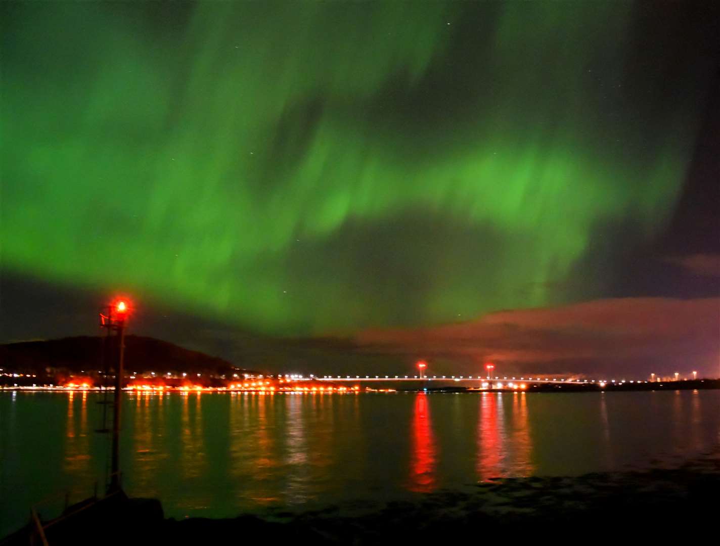 The Northern Lights above the Kessock Bridge and Ord Hill in Inverness. Picture: Philip Murray.