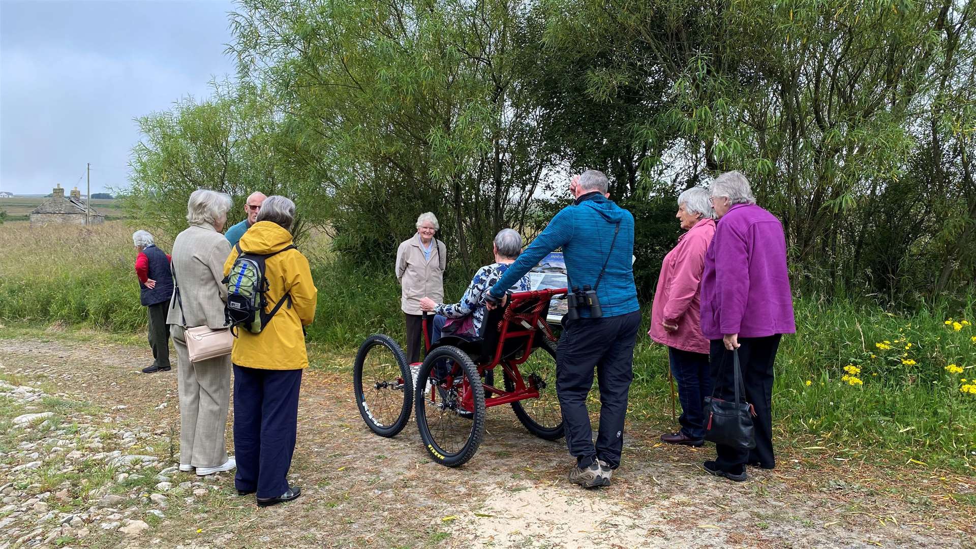 George Ewing and the group from Dunbeath & District Centre with the Paratreker All Terrain wheelchair.