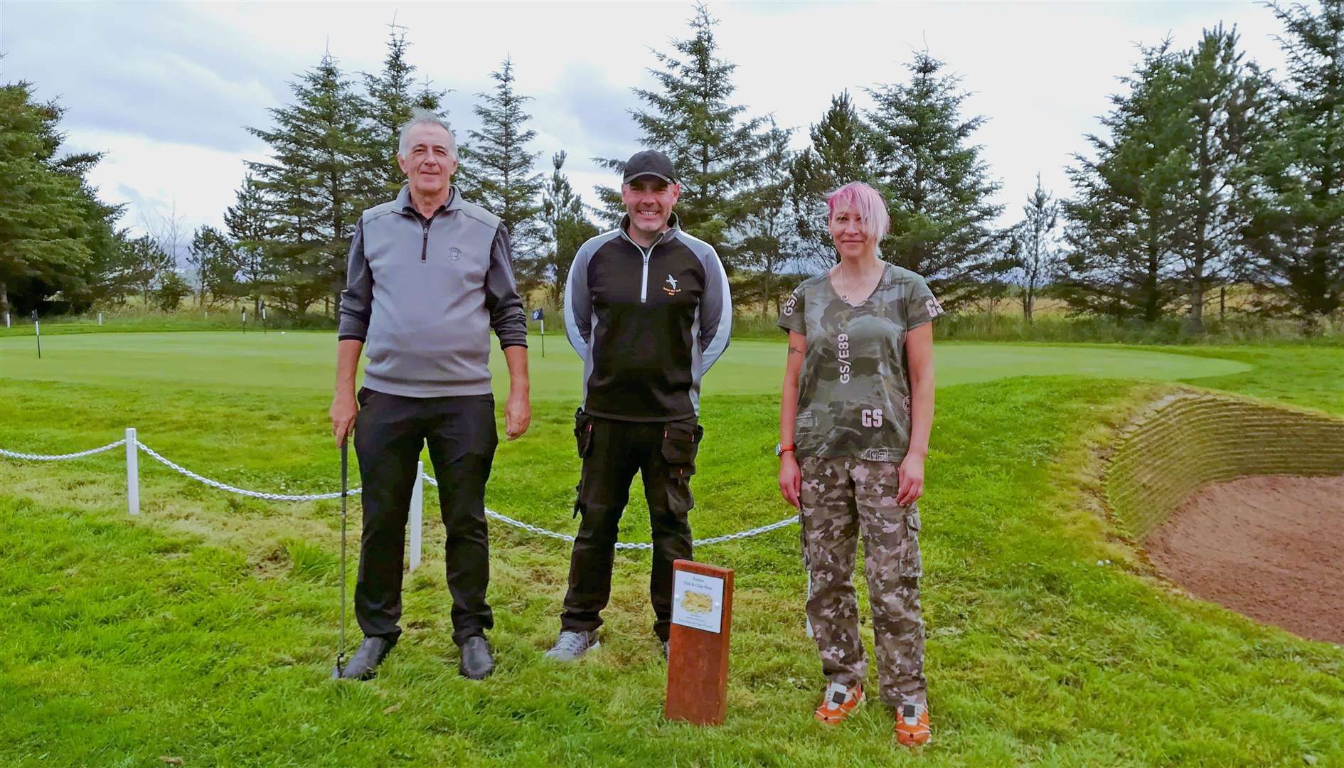 Thurso Golf Club's Clark Grant (left) and Frazer Sparling with Jacqueline Maclean, representing Robin's Fish and Chip Shop, which has sponsored the new practice green.