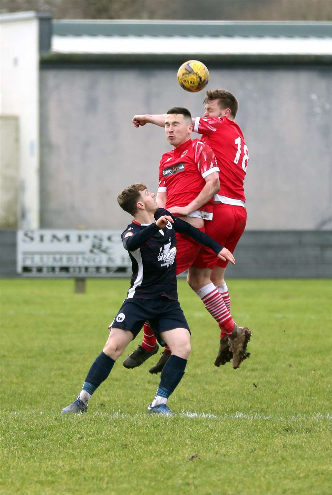 Andrew Hardwick wins a header from team-mate Jack McKechnie and Inverness Athletic's Cammy McCheyne. Picture: James Gunn