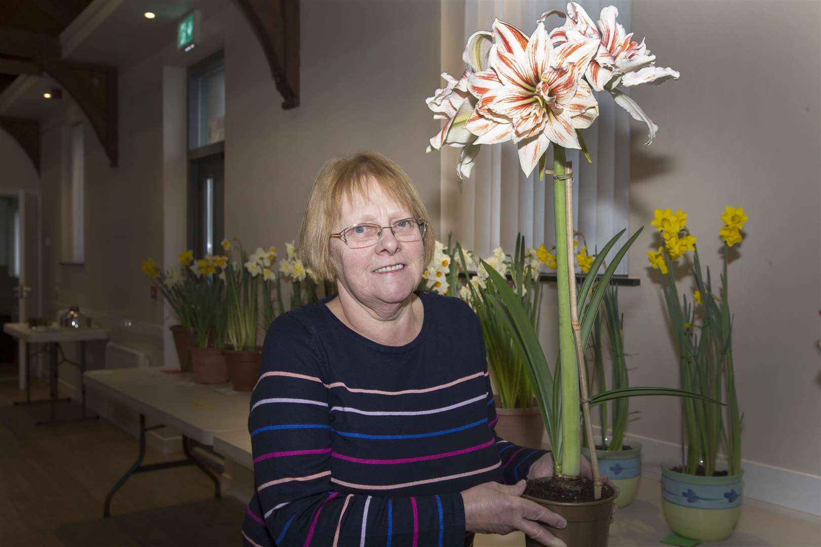 Maureen Johnson with her amaryllis that won the best exhibit trophy at Reiss Gardening Club's annual bulb show. Picture: Robert MacDonald / Northern Studios
