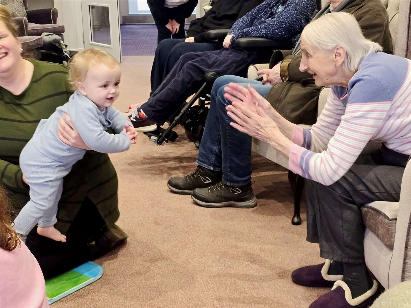 Gwen Stewart with one of the toddlers.
