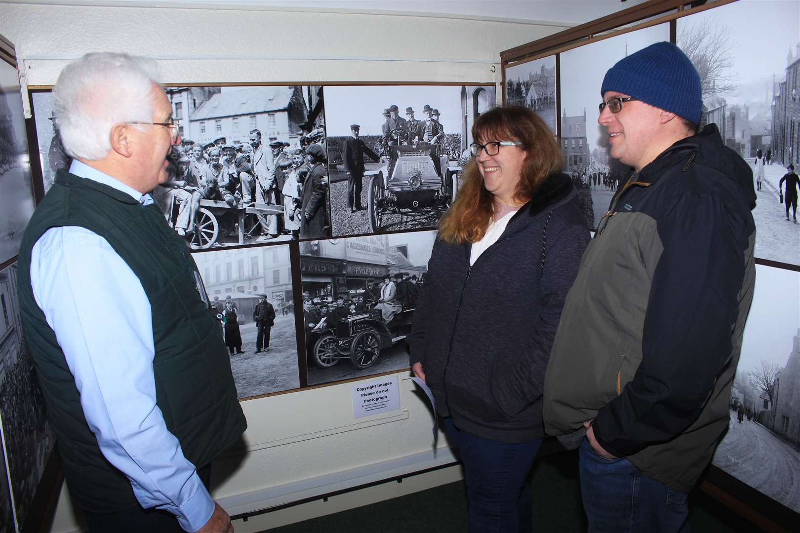 Malcolm Bremner, vice-chairman of the Wick Society, telling visitors about the Johnston photographic collection. Picture: Alan Hendry
