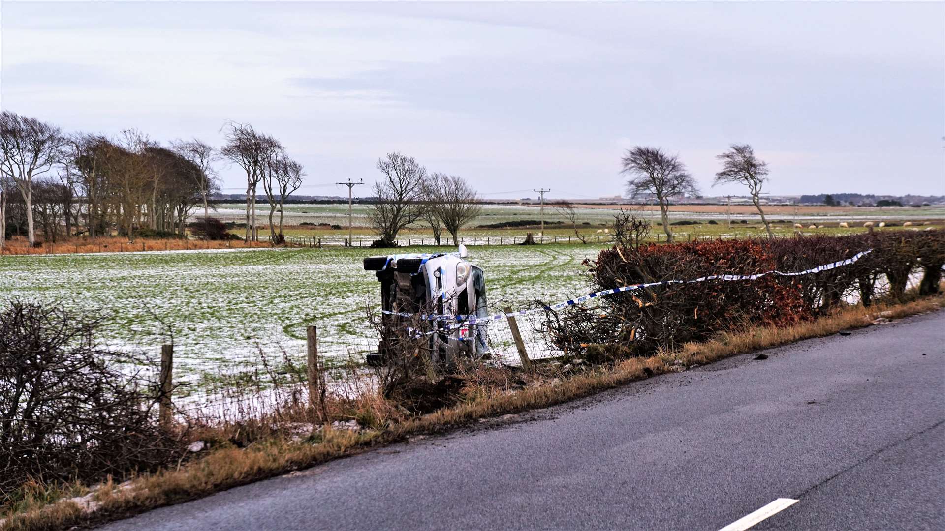 The car was lying on its side in a field at Stirkoke with its windscreen smashed in.