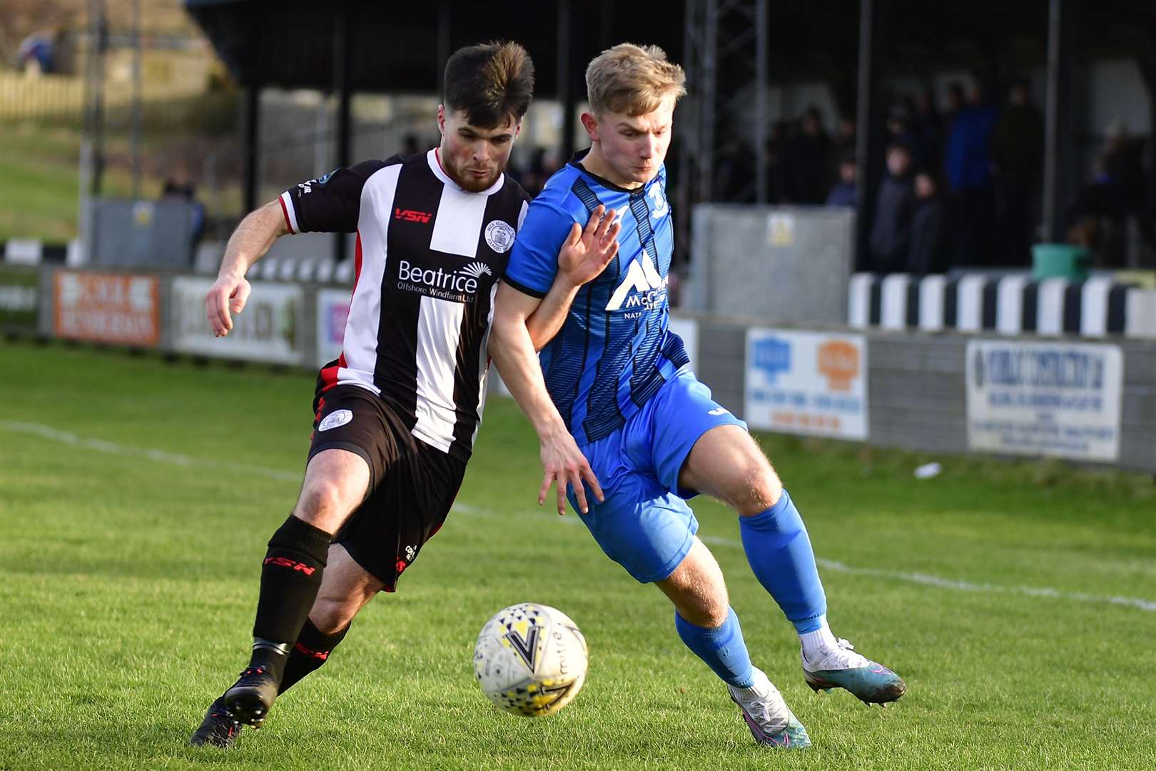 Wick Academy's Sean Campbell with Strathspey Thistle goalscorer Jack Davison. Picture: Mel Roger