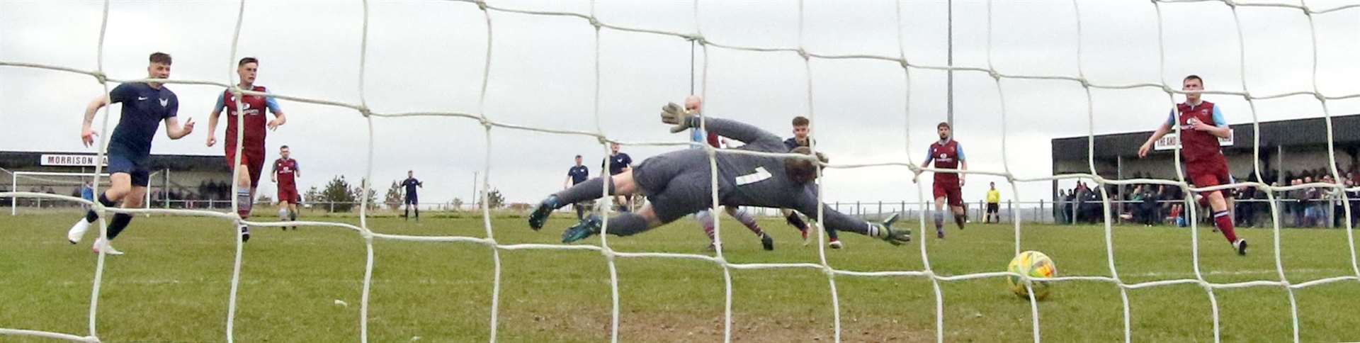 Pentland United keeper Michael Gray is unable to reach Mark Munro's shot for the winning goal. Picture: James Gunn