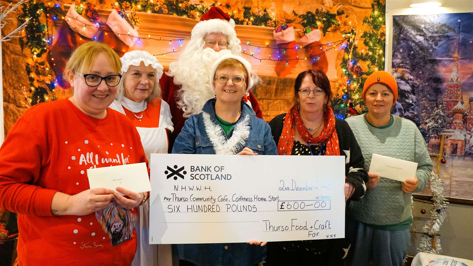 From left, Kirsteen Campbell from North Highland Women’s Wellness Hub, Yvonne Rathbone, Penny Irvine and Ann Brock from the Thurso Community Café. Santa and Mrs Claus are, of course, behind the group. Picture: DGS
