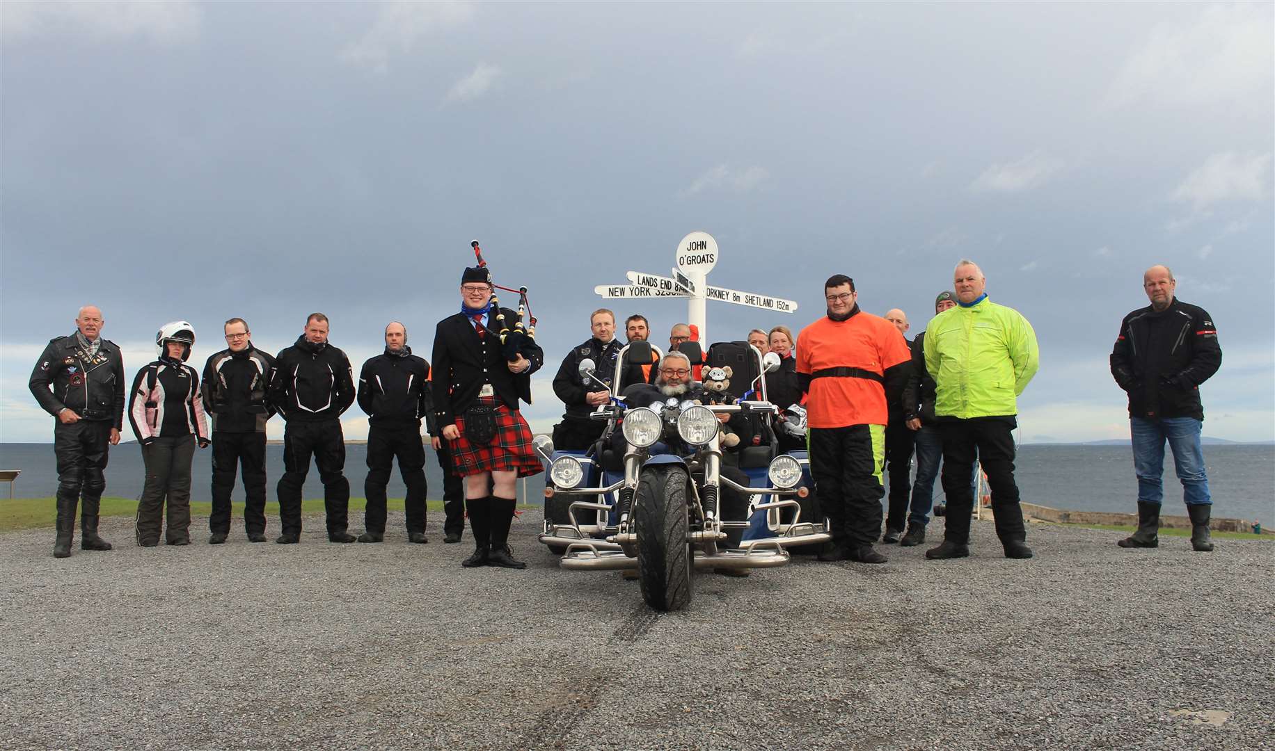 Motorcyclists from Orkney and Caithness, with Jeffrey DaBear sitting in John Foster's trike, before setting off from John O'Groats on Saturday morning. Picture: Alan Hendry
