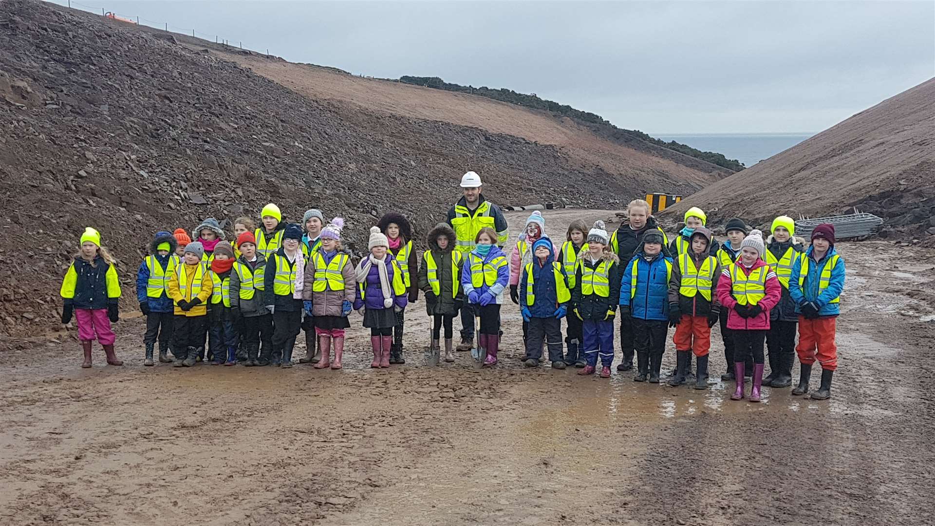 Pupils at the site of the Berriedale road project.