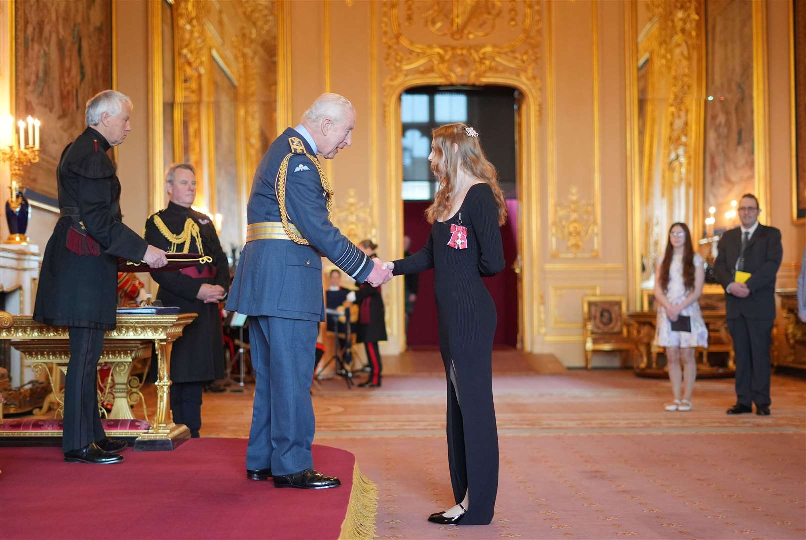 Poppy Maskill is made a Member of the Order of the British Empire by the King at Windsor Castle (Jordan Pettitt/PA)