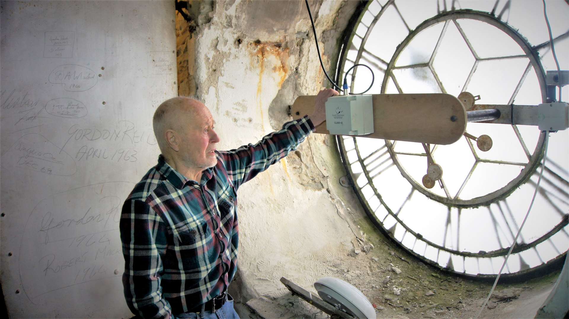The town clock – seen from the inside with Bill Brown who wound up the clock before it went electric – has been out of action for some time. Picture: DGS