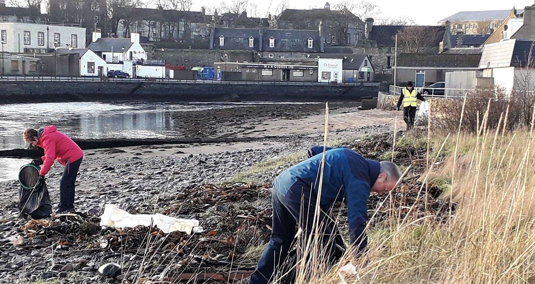 Wick Paths Group volunteers working away to clear away rubbish left after last week's storm.