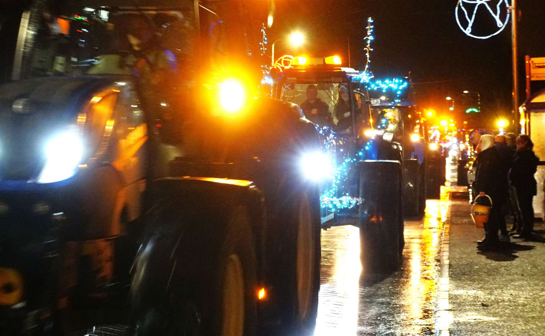 Young Farmers centenary tractor run travels through Watten on its way to Wick. Picture: DGS