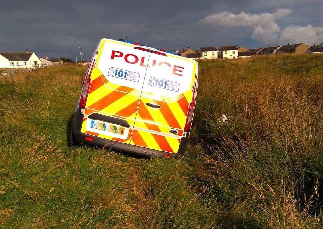 The police vehicle was stuck while out on a 'routine patrol' on Saturday evening.